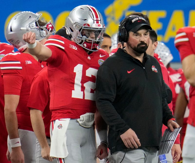 Ohio State quarterback Lincoln Kienholz talks to coach Ryan Day during the Cotton Bowl on Dec. 29.