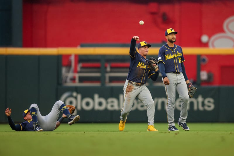 Aug 4, 2025; Atlanta, Georgia, USA; Milwaukee Brewers left fielder Isaac Collins (6) throws the ball against the Atlanta Braves in the second inning at Truist Park. Mandatory Credit: Brett Davis-Imagn Images