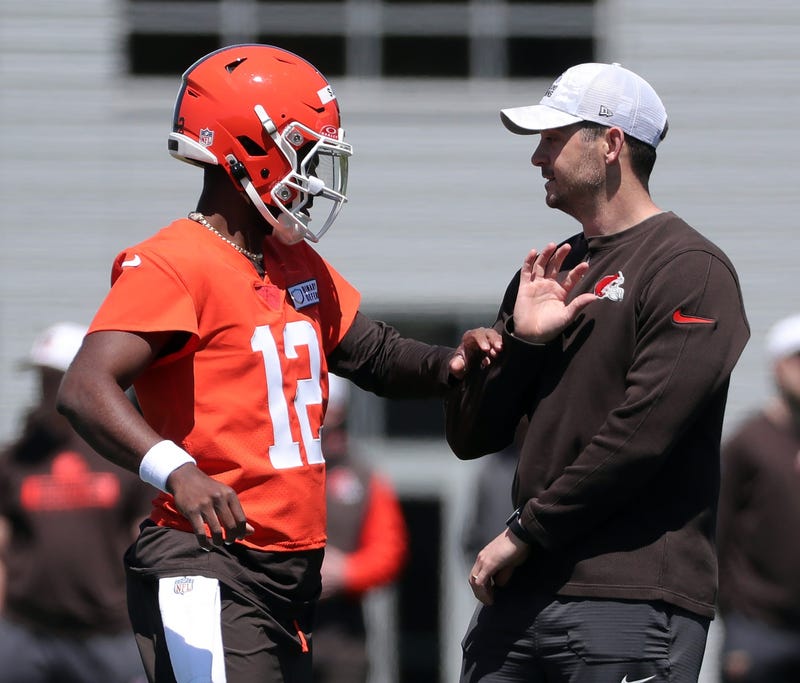 Browns quarterback Shedeur Sanders works with offensive coordinator Tommy Rees during rookie minicamp May 9, 2025, in Berea.