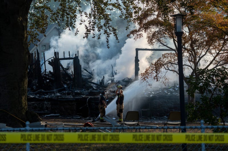 Firefighters continue to hose the remains of Congregation Beth El synagogue after an overnight fire destroyed the building in Rutherford on Friday, Aug. 8, 2025