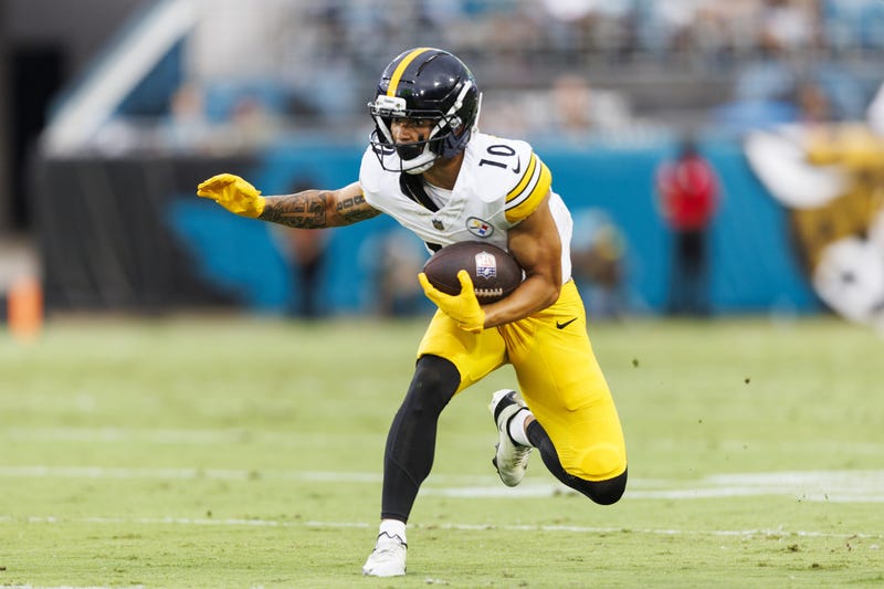Roman Wilson with the football