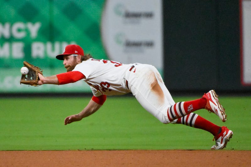 St. Louis Cardinals second baseman Brendan Donovan (33) dives and catches a line drive hit by Colorado Rockies center fielder Brenton Doyle (not pictured) during the seventh inning at Busch Stadium.