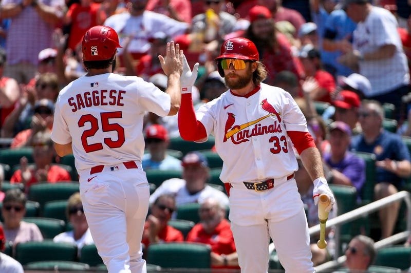 St. Louis Cardinals third baseman Thomas Saggese (25) is congratulated by second baseman Brendan Donovan (33) after scoring against the Colorado Rockies during the second inning at Busch Stadium.