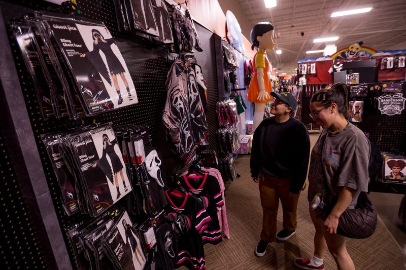 El Pasoans look at the Ghostface display at Spirit Halloween at the Shoppes of Solana in West El Paso on Wednesday, Aug. 13, 2025.