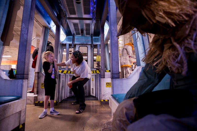 Ebone Gaston, who is celebrating her birthday, and her sister Olive Patterson react to an animatronic inside the subway scene for Spirit Halloween’s 2025 Haunted Subway theme at the Shoppes of Solana in West El Paso on Wednesday, Aug. 13, 2025.