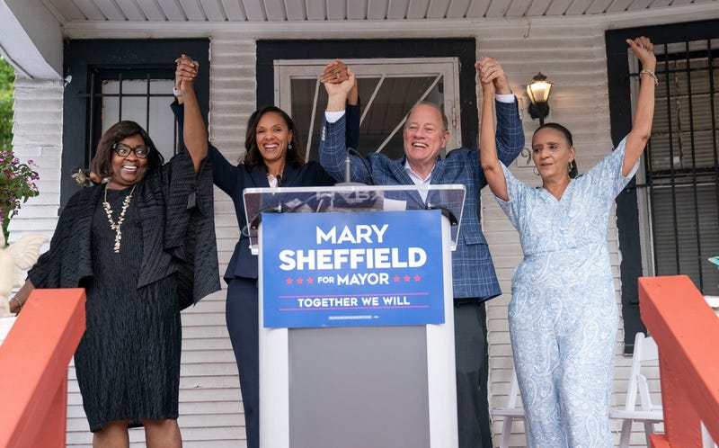 Mary Sheffield and Mike Duggan holding hands
