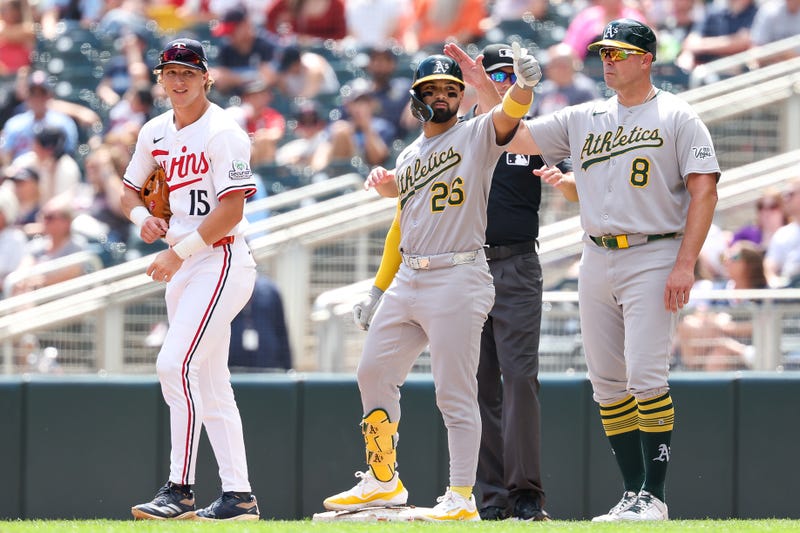 Athletics right fielder Carlos Cortes (26) celebrates his RBI single against the Minnesota Twins during the second inning at Target Field during the A's 8-3 Thursday.
