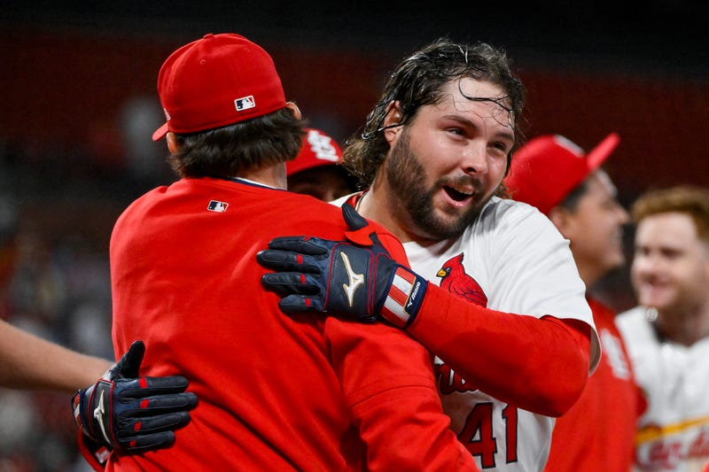 St. Louis Cardinals first baseman Alec Burleson (41) celebrates with teammates after hitting a walk-off solo home run against the Pittsburgh Pirates during the ninth inning at Busch Stadium.