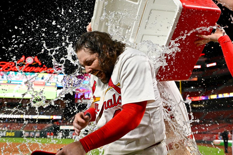 St. Louis Cardinals first baseman Alec Burleson (41) is doused with water by teammates after hitting a walk-off solo home run against the Pittsburgh Pirates during the ninth inning at Busch Stadium.