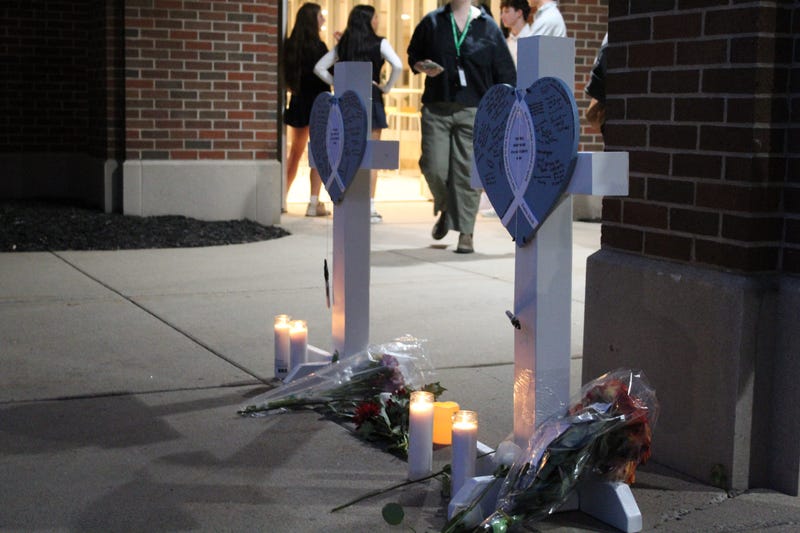 Vigil attendees wrote messages on crosses for the two children who died in the Aug. 27 Annunciation Church shooting in Minneapolis.