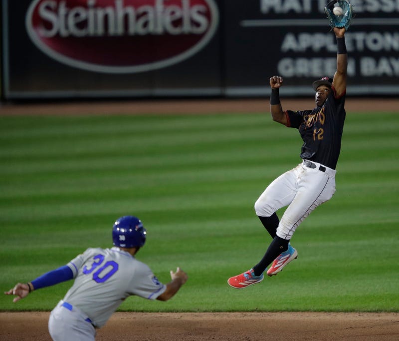 Wisconsin Timber Rattlers' Jesus Made (12) makes a leaping catch during their baseball game against the Quad Cities River Bandits Wednesday, August 27, 2025, at Neuroscience Group Field at Fox Cities Stadium in Grand Chute, Wisconsin. Quad City won 9-5.
