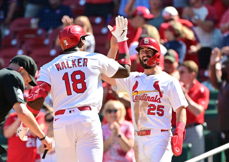 St. Louis Cardinals right fielder Jordan Walker (18) is greeted at home plate by second baseman Thomas Saggese (25) after Walker hit a two-run home run in the seventh inning against the Pittsburgh Pirates at Busch Stadium.