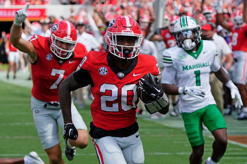 Georgia running back Dwight Phillips Jr (20) drives in for a touchdown during the first half of a NCAA college football game against Marshall in Athens, Ga., on Saturday, August. 30, 2025.