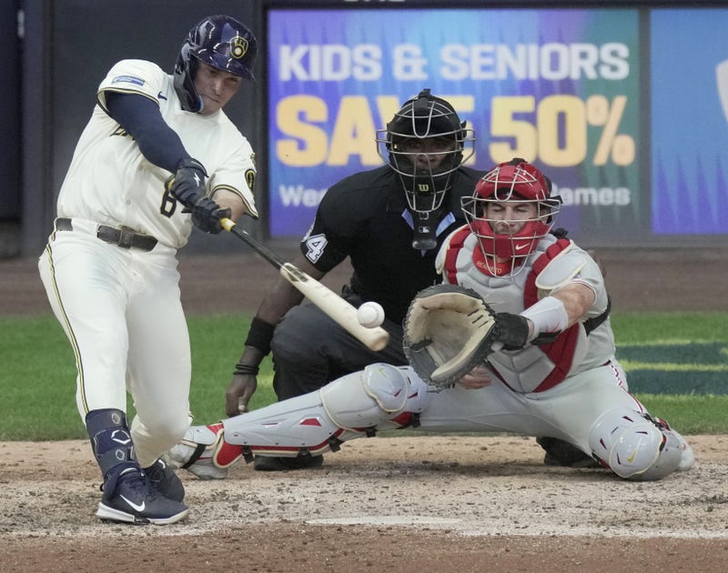 Sep 1, 2025; Milwaukee, Wisconsin, USA; Milwaukee Brewers outfielder Isaac Collins (6) hits drives in two runs on a single during the eighth inning of their game against the Philadelphia Phillies Monday, September 1, 2025 at American Family Field in Milwaukee, Mandatory Credit: Mark Hoffman/USA TODAY Network via Imagn Images