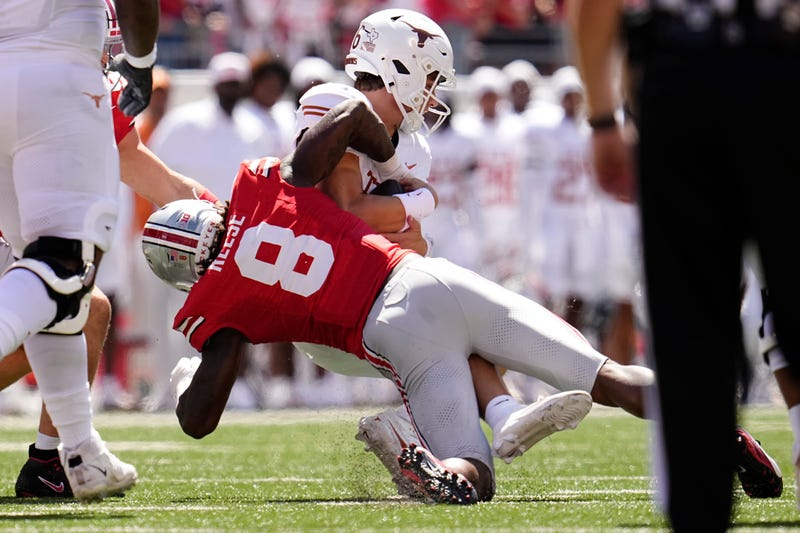 Ohio State Buckeyes linebacker Arvell Reese (8) tackles Texas Longhorns quarterback Arch Manning (16) during the NCAA football game at Ohio Stadium on Aug. 30, 2025.