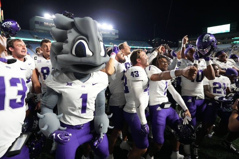TCU Horned Frogs players celebrate after the game at Kenan Stadium