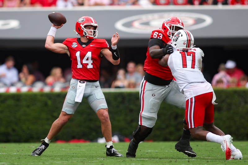  Georgia Bulldogs quarterback Gunner Stockton (14) throws a pass against the Austin Peay Governors in the first quarter at Sanford Stadium.