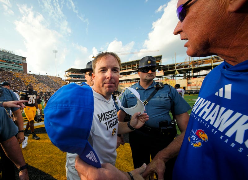 Missouri Tigers head coach Eliah Drinkwitz greets Kansas Jayhawks head coach Lance Leipold after a game at Faurot Field at Memorial Stadium.