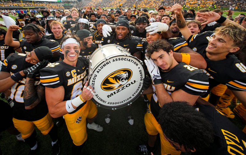 The Missouri Tigers celebrate after defeating the Kansas Jayhawks at Faurot Field at Memorial Stadium.