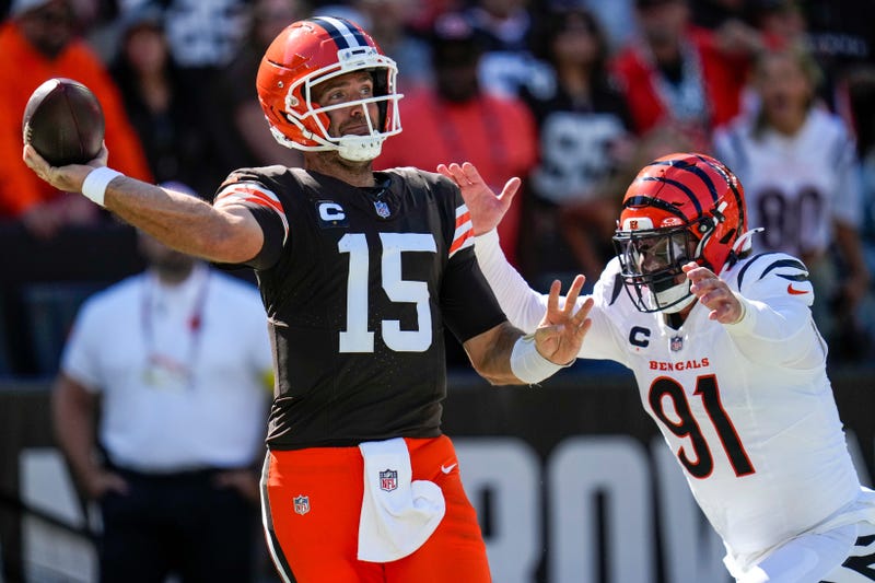 Cleveland Browns quarterback Joe Flacco (15) is chased through the end zone by Cincinnati Bengals defensive end Trey Hendrickson (91) in the fourth quarter of the NFL Week 1 game between the Cleveland Browns and the Cincinnati Bengals at Huntington Bank Field in Cleveland on Sunday, Sept. 7, 2025. The Bengals begin the season with a 17-16 win over the Browns.