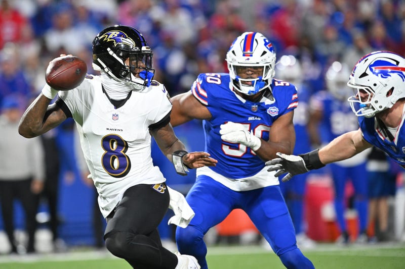 Sep 7, 2025; Orchard Park, New York, USA; Baltimore Ravens quarterback Lamar Jackson (8) runs the ball during the fourth quarter against the Buffalo Bills at Highmark Stadium.