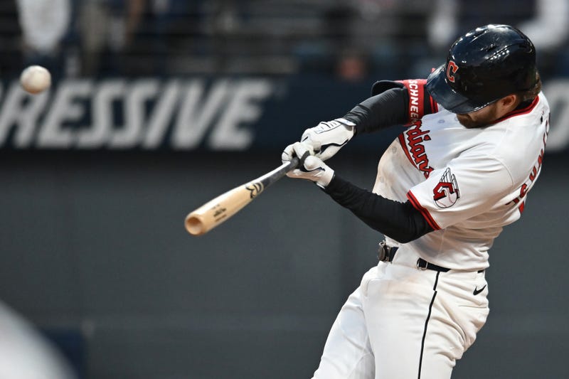 Cleveland Guardians center fielder Daniel Schneemann (10) hits an RBI double against the Kansas City Royals during the fourth inning at Progressive Field.