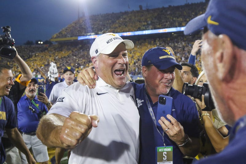 Rich Rodriguez celebrates West Virginia win over Pitt