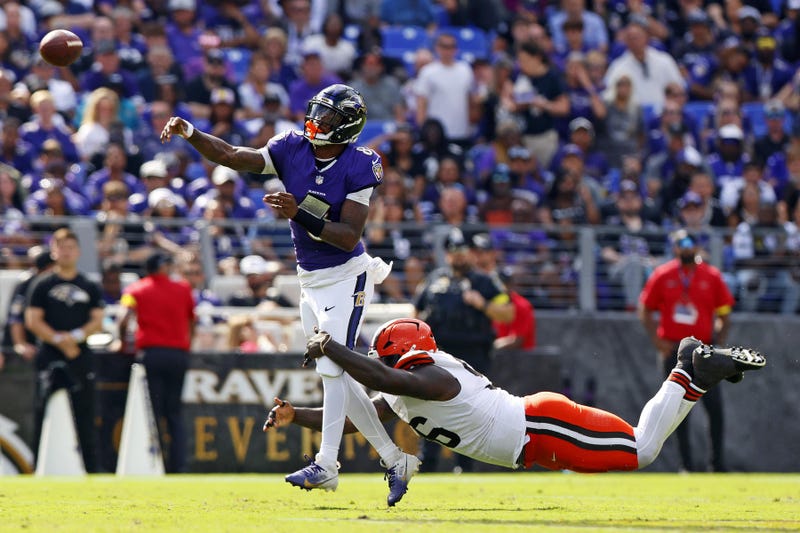 Sep 14, 2025; Baltimore, Maryland, USA; Baltimore Ravens quarterback Lamar Jackson (8) throws a pass under pressure from Cleveland Browns defensive tackle Maliek Collins (96) during the fourth quarter at M&T Bank Stadium.