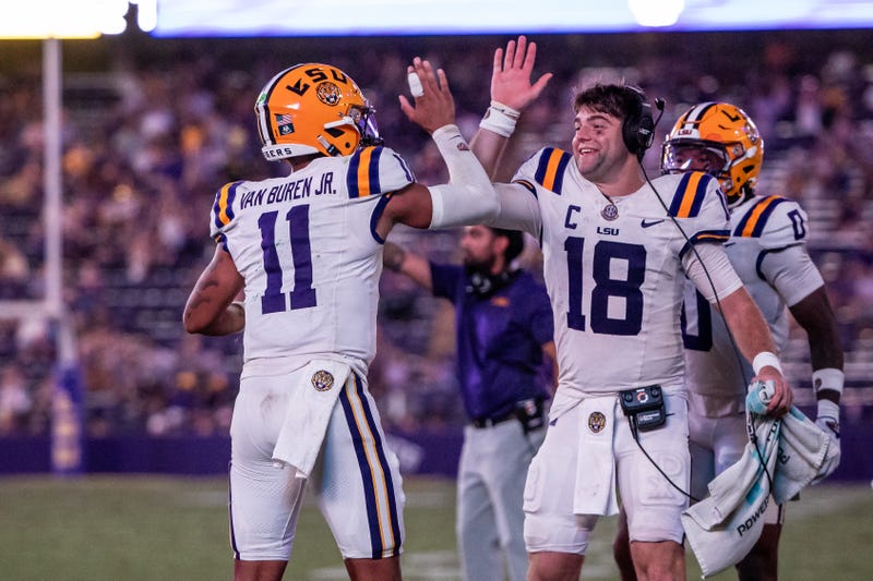 LSU Tigers quarterback Garrett Nussmeier (18) congratulates LSU Tigers quarterback Michael Van Buren Jr. 