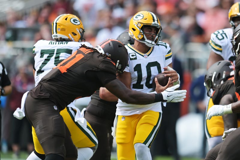 Sep 21, 2025; Cleveland, Ohio, USA; Cleveland Browns defensive end Alex Wright (91) sacks Green Bay Packers quarterback Jordan Love (10) during the second quarter at Huntington Bank Field. Mandatory Credit: Ken Blaze-Imagn Images