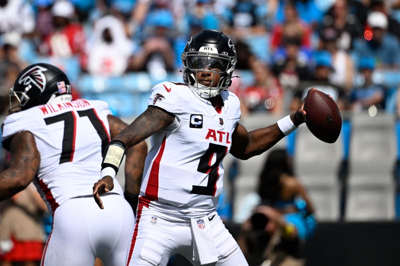 Atlanta Falcons quarterback Michael Penix Jr. (9) throws an interception in the third quarter at Bank of America Stadium