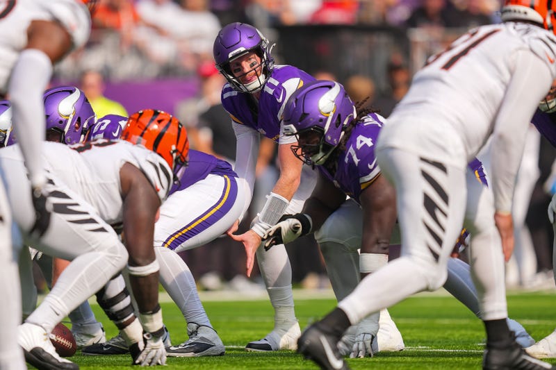 Minnesota Vikings quarterback Carson Wentz (11) under center against the Cincinnati Bengals during their 48-10 win. Head Coach Kevin O'Connell says Wentz will start again this week in Dublin against the Steelers but do it without his left guard, Donovan Jackson (74) who had wrist surgery.
