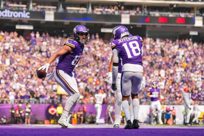 Minnesota Vikings tight end TJ. Hockenson (87) reacts with wide receiver Justin Jefferson (18) after catching a touchdown pass against the Cincinnati Bengals during the second half at U.S. Bank Stadium.