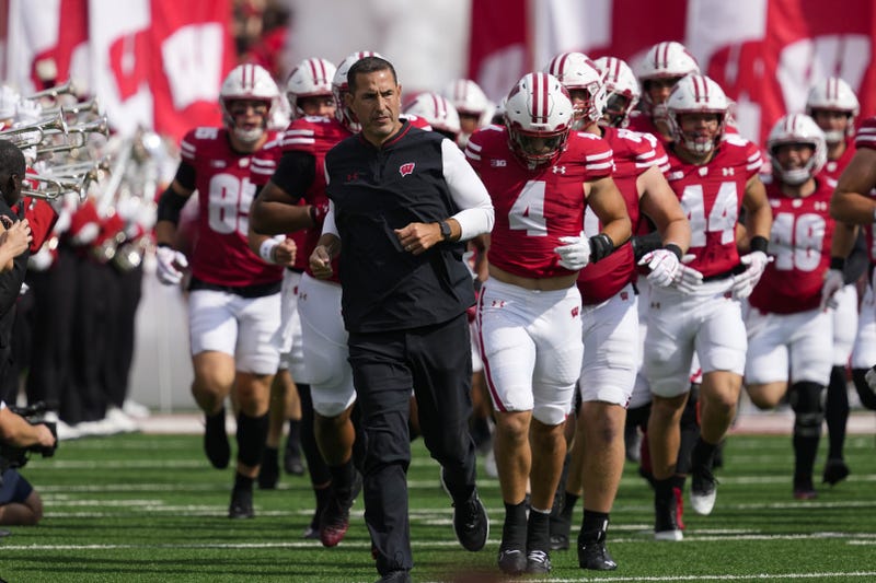 Sep 20, 2025; Madison, Wisconsin, USA; Wisconsin Badgers head coach Luke Fickell runs onto the field ahead of players prior to the game against the Maryland Terrapins at Camp Randall Stadium. Mandatory Credit: Jeff Hanisch-Imagn Images