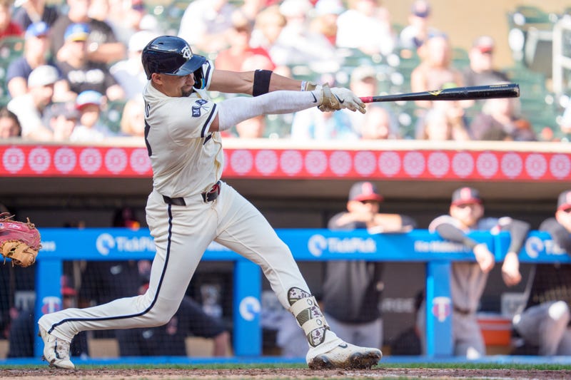 Minnesota Twins third base Royce Lewis (23) swings at a Cleveland Guardians pitcher Hunter Gaddis (33) pitch in the seventh inning at Target Field. 