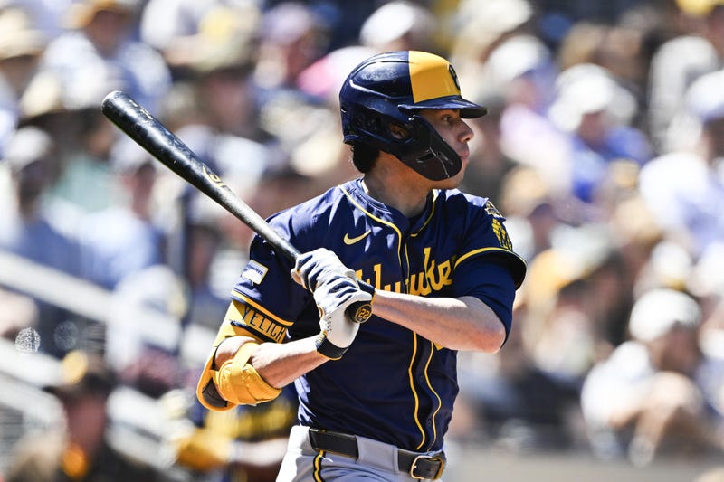 Sep 24, 2025; San Diego, California, USA; Milwaukee Brewers left fielder Christian Yelich (22) hits a single during the first inning against the San Diego Padres at Petco Park. Mandatory Credit: Denis Poroy-Imagn Images