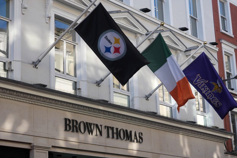 The flags of the Pittsburgh Steelers, Ireland, and the Minnesota Vikings wave side by side