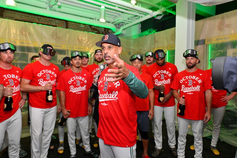 Boston Red Sox manager Alex Cora (13) addresses the team after they clinched a playoff spot after their game against the Detroit Tigers at Fenway Park.