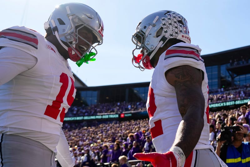 Ohio State Buckeyes tight end Jelani Thurman (15) celebrates a touchdown by running back CJ Donaldson (12) during the second half of the NCAA football game against the Washington Huskies at Husky Stadium in Seattle on Sept. 27, 2025. Ohio State won 24-6.
