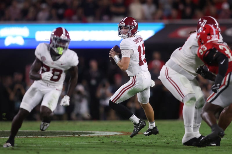 Alabama Crimson Tide quarterback Ty Simpson (15) looks to pass in the first half against the Georgia Bulldogs at Sanford Stadium