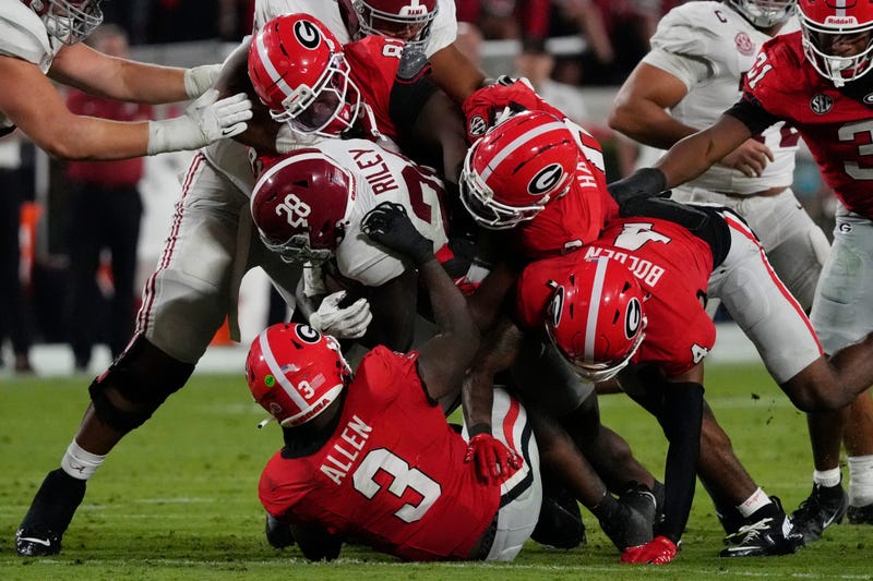 Alabama Crimson Tide running back Kevin Riley (28) is stopped by the Georgia Bulldogs defense during the second half of a NCAA college football game against Alabama in Athens, Ga., on Saturday, September 27, 2025.