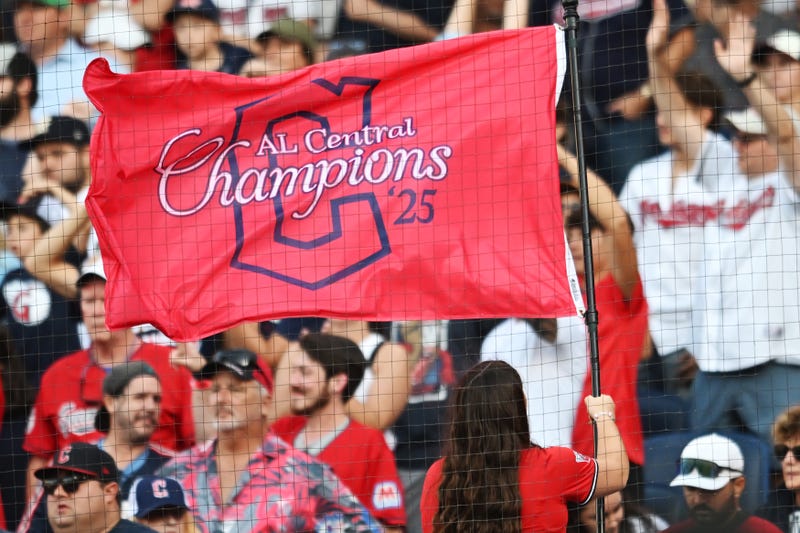 Sep 28, 2025; Cleveland, Ohio, USA; A member of the Cleveland Strikers waves an American League Central Division champions flag during the game between the Cleveland Guardians and the Texas Rangers at Progressive Field. Mandatory Credit: Ken Blaze-Imagn Images