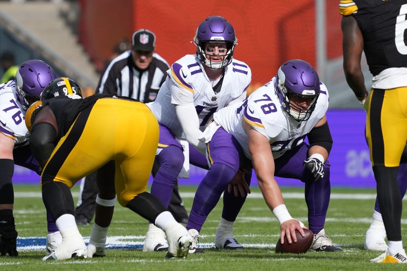 Vikings quarterback Carson Wentz (11) takes the snap from center Ryan Kelly (78) in the first half against the Pittsburgh Steelers during an NFL International Series game at Croke Park. 