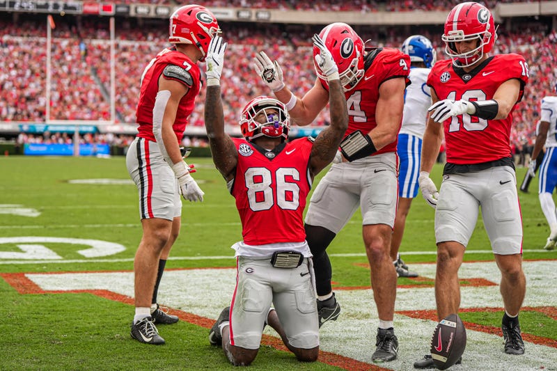 Georgia Bulldogs wide receiver Dillon Bell (86) reacts after scoring a touchdown against the Kentucky Wildcats during the first half at Sanford Stadium.