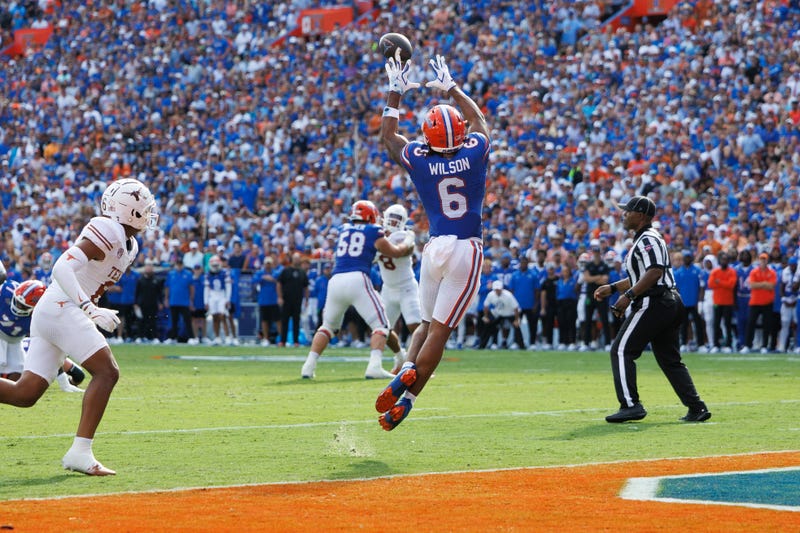 Florida Gators wide receiver Dallas Wilson (6) makes a catch for a touchdown against the Texas Longhorns during the first half at Ben Hill Griffin Stadium.