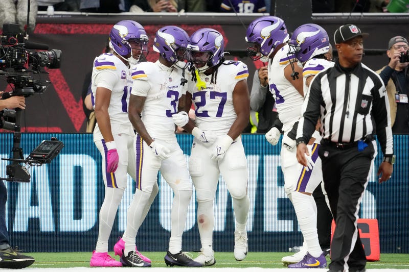 Minnesota Vikings wide receiver Jordan Addison (3) celebrates with teammates after a touchdown against the Cleveland Browns during the fourth quarter of an NFL International Series game at Tottenham Hotspur Stadium.