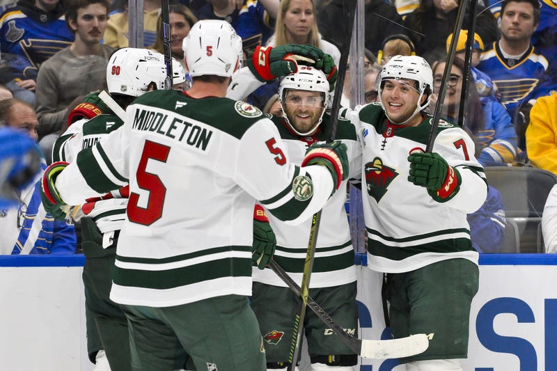 Minnesota Wild right wing Ryan Hartman (38) is congratulated by teammates after scoring against the St. Louis Blues during the first period at Enterprise Center. 