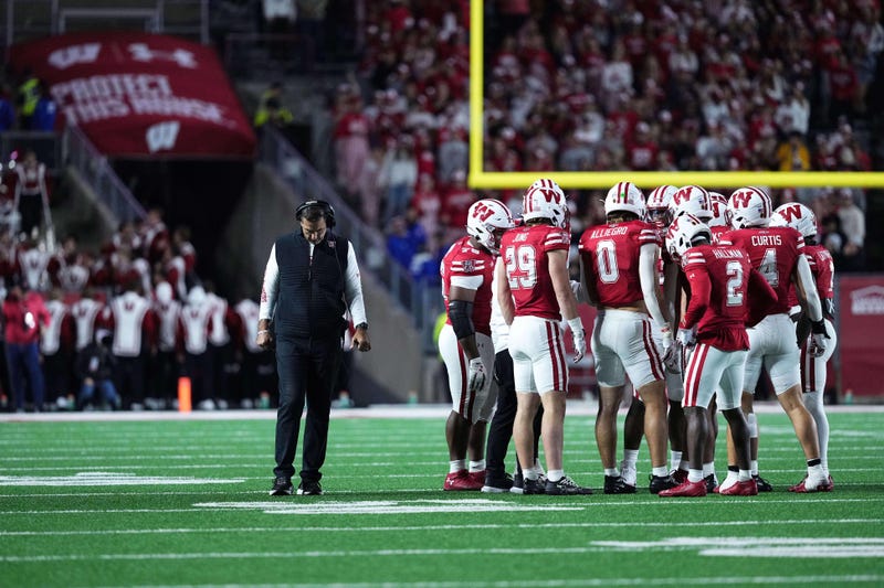 Oct 11, 2025; Madison, Wisconsin, USA; Wisconsin Badgers head coach Luke Fickell and his team take a timeout in the second half against the Iowa Hawkeyes at Camp Randall Stadium. Mandatory Credit: Ross Harried-Imagn Images