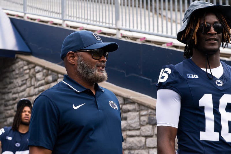 Terry Smith talking with Penn State player