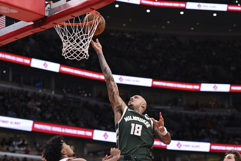 Oct 12, 2025; Chicago, Illinois, USA; Milwaukee Bucks forward Kyle Kuzma (18) scores against the Chicago Bulls during the second half at the United Center. Mandatory Credit: Matt Marton-Imagn Images